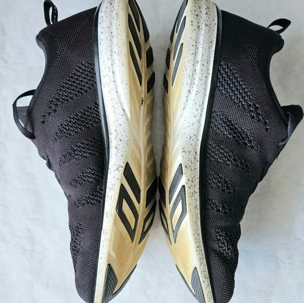 APL Techloom Pro black running shoes speckled soles